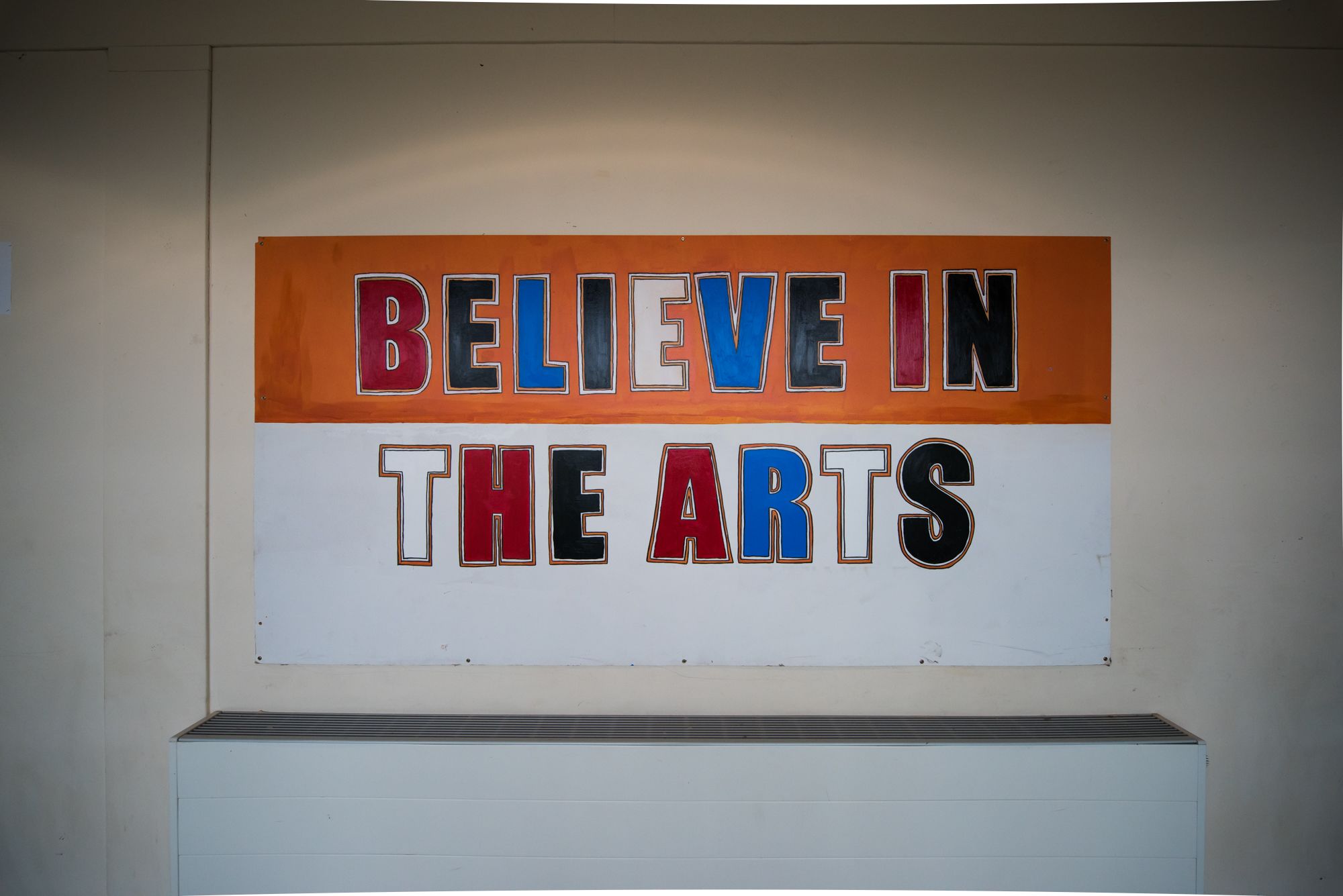 Believe in the arts sign
